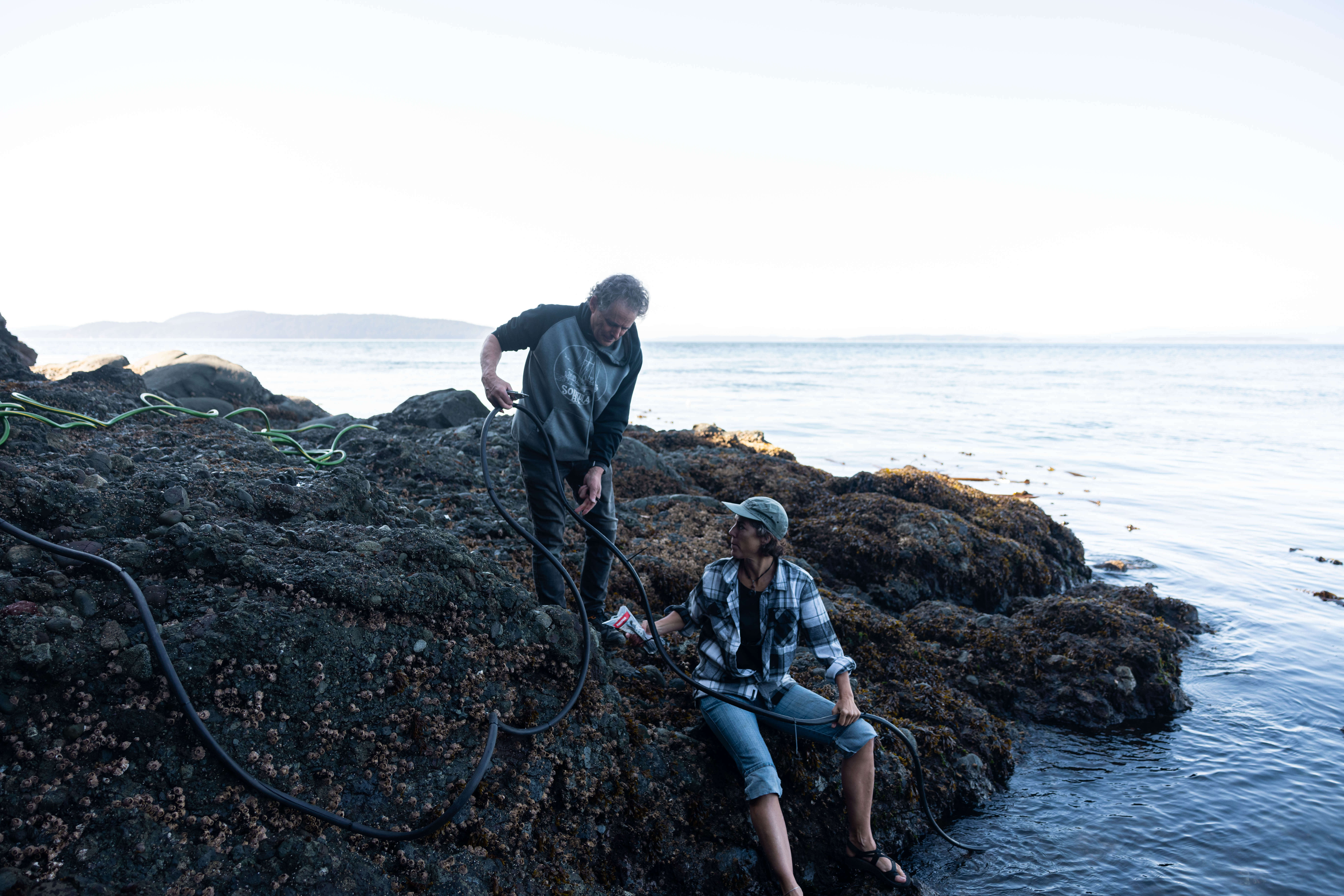 Dr. Valeria Vergara and Dr. Lance Barrett-Lennard, Cetacean Conservation Research Program Directors at Raincoast, prepare the Pender hydrophone for deployment. Photo by Alex Harris.